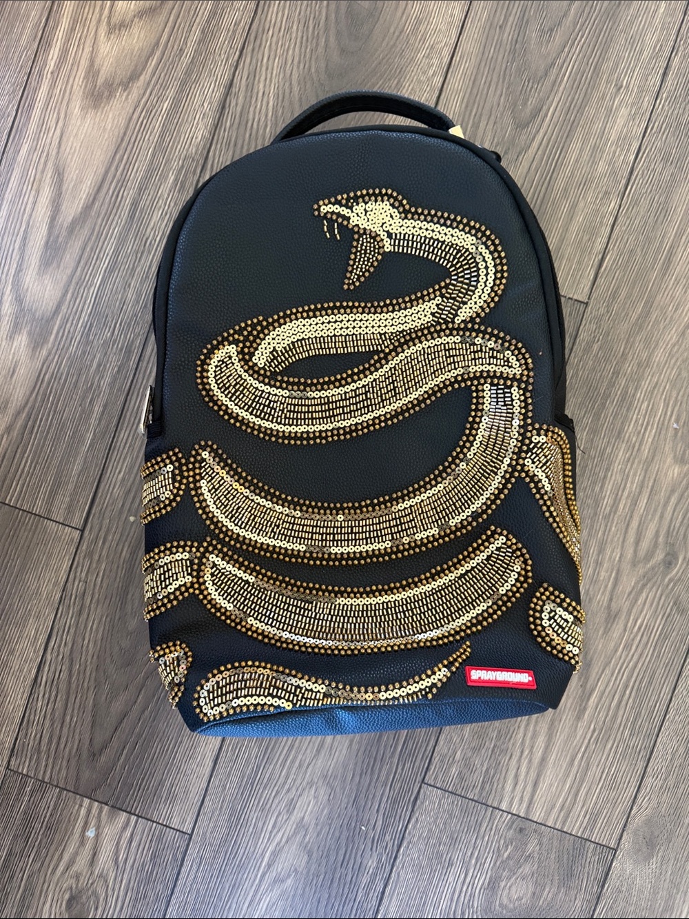 Sprayground Black Backpack with Gold Sequin Snake Motif